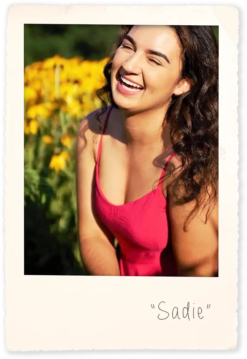 Portrait of Siena Bott sitting in sunflower field inside a Polaroid picture frame